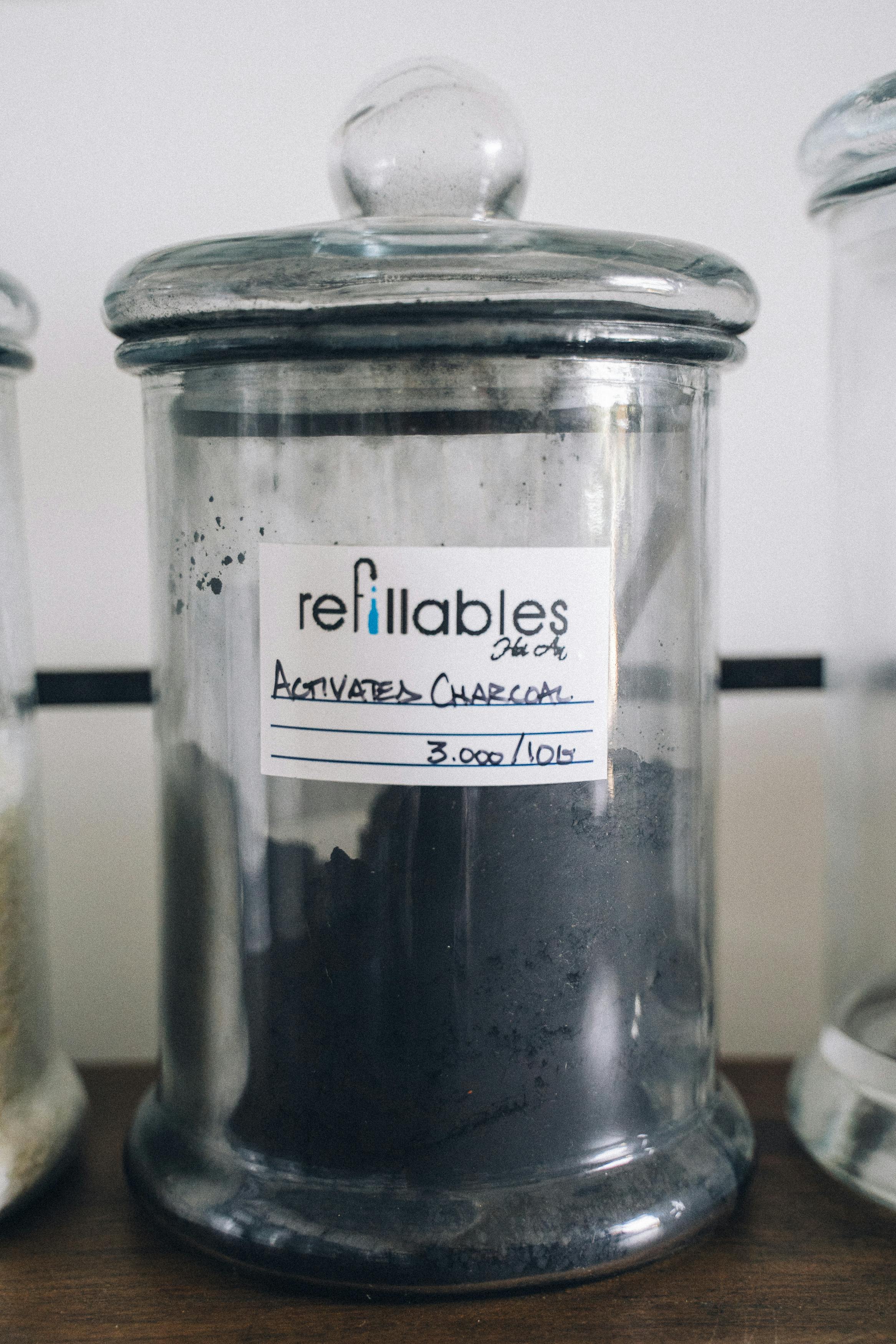 Jar of activated charcoal binder Jar of activated charcoal binder