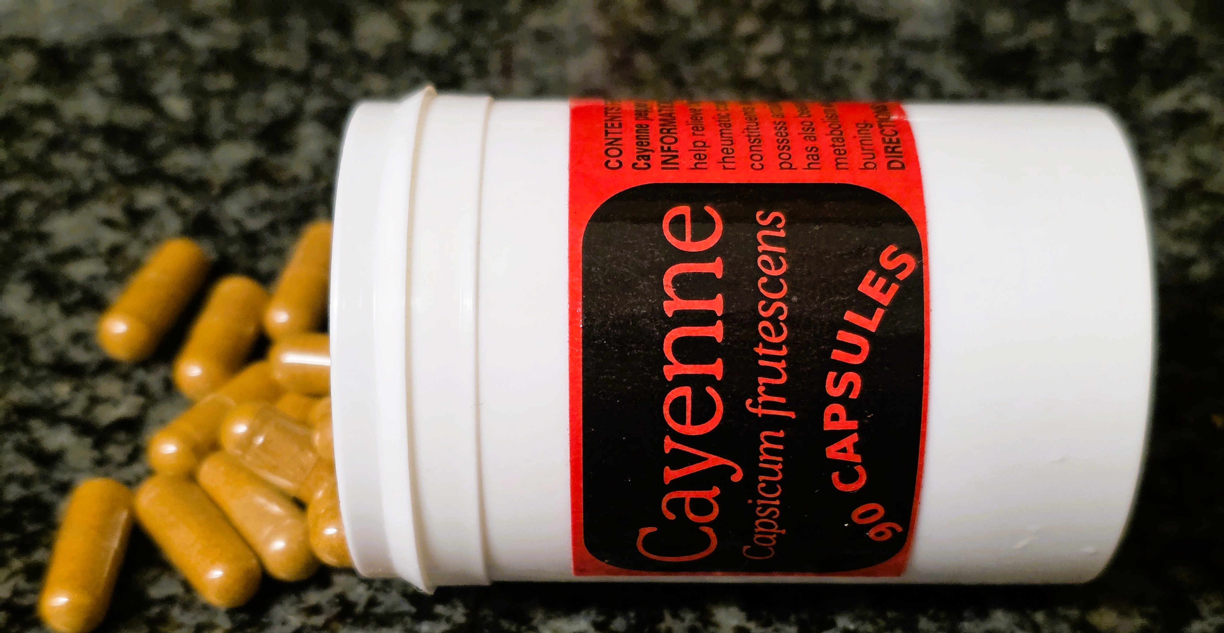cayenne pepper capsules on a counter cayenne pepper capsules on a counter