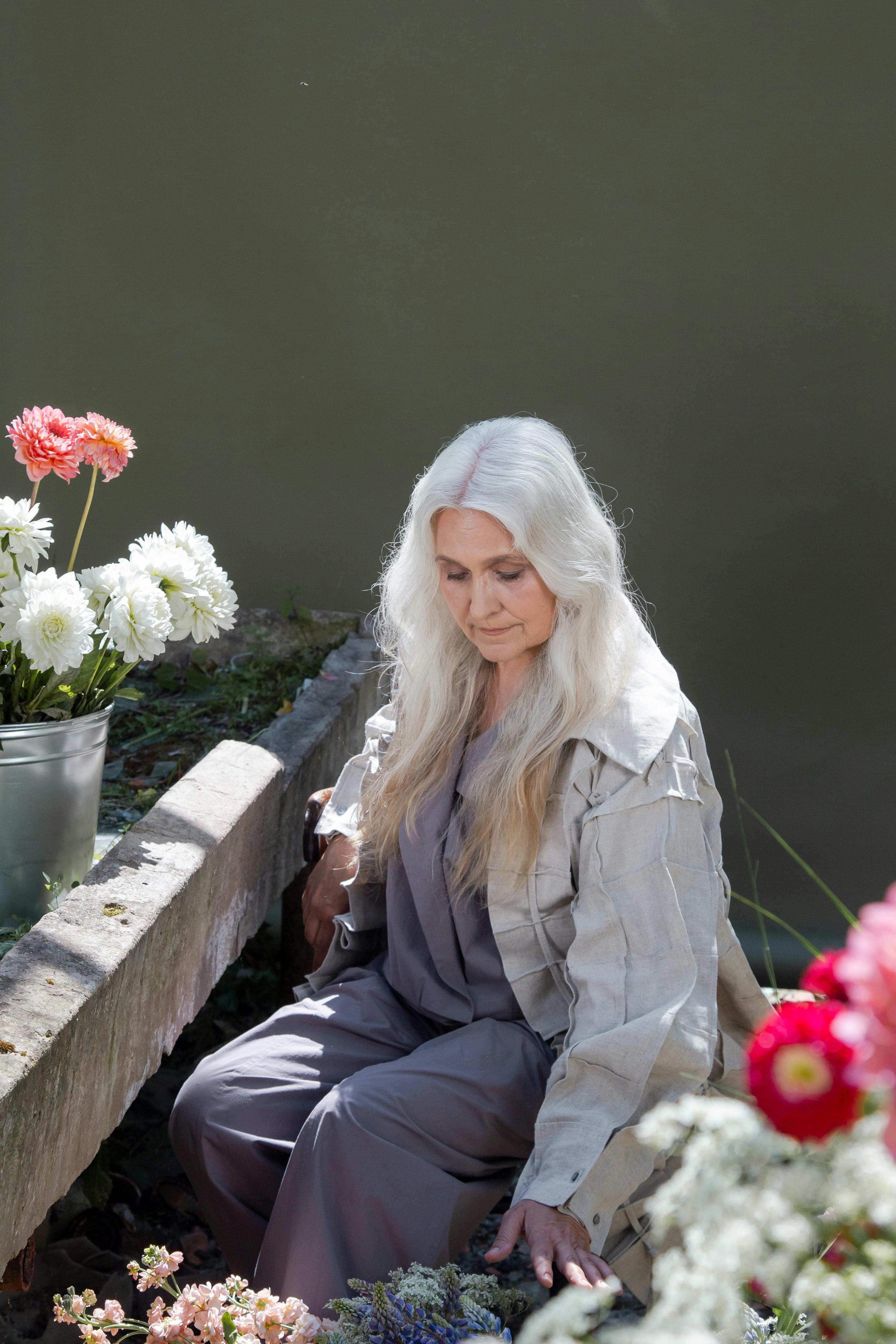 grey hair lady in garden