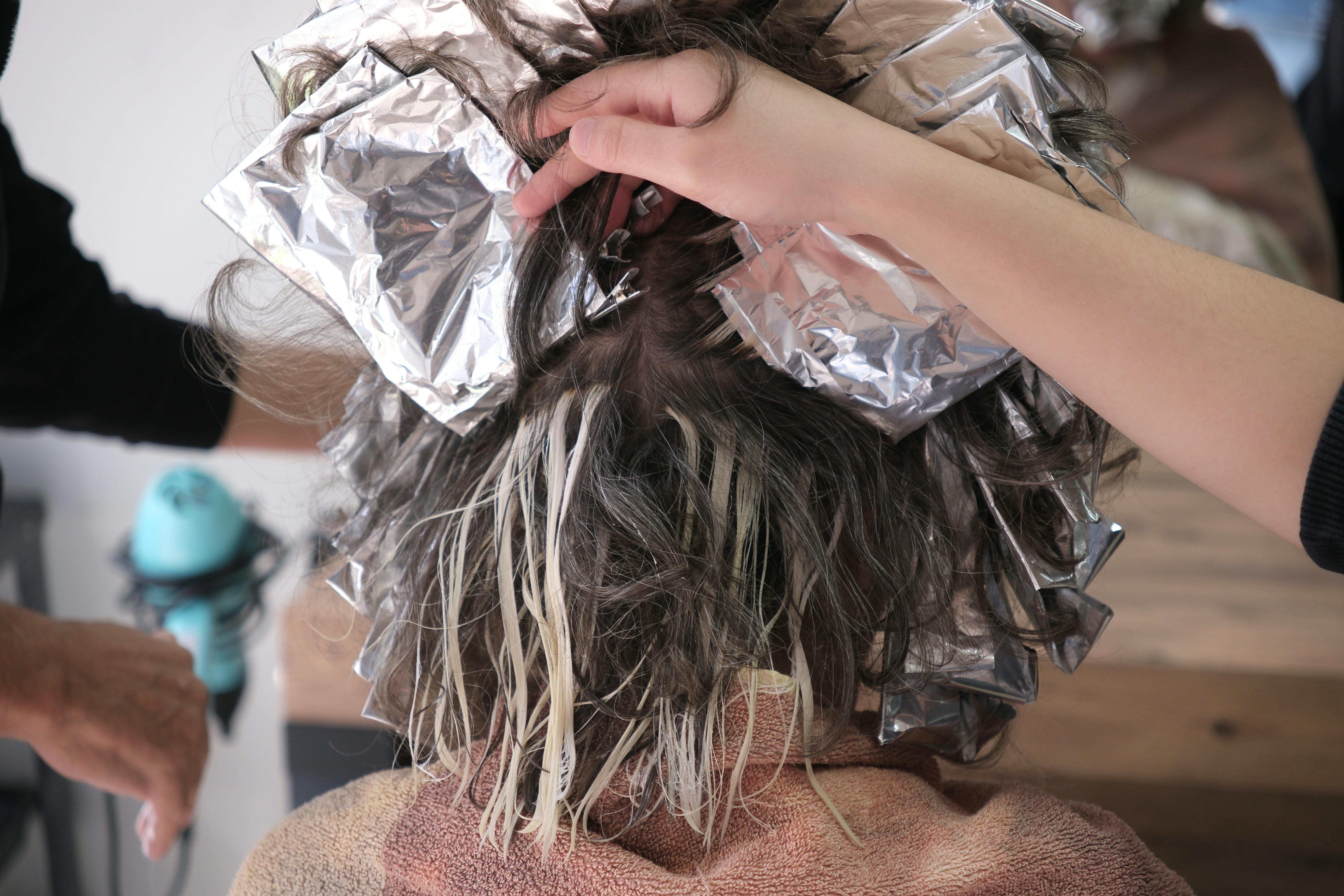 hair being dyed with foils